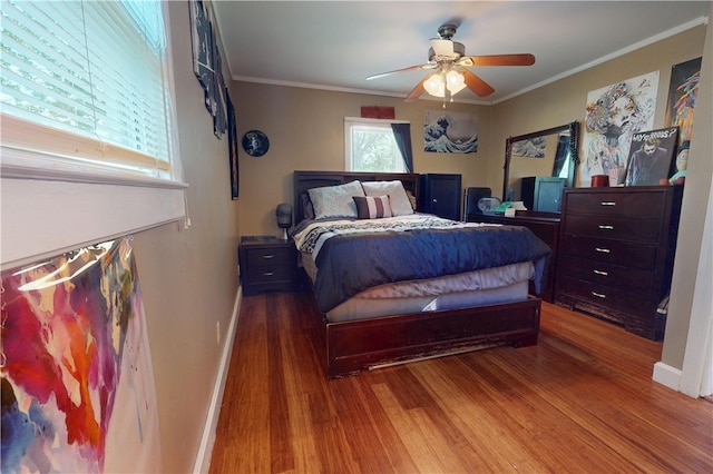 220 W Highland St, Siloam Springs, AR 72761 - bedroom featuring wood finished floors, baseboards, crown molding, and ceiling fan