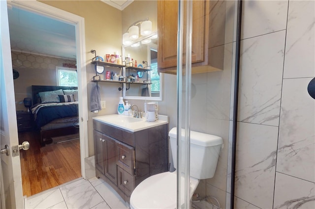 220 W Highland St, Siloam Springs, AR 72761 - full bath with ensuite bathroom, vanity, toilet, marble finish floors, and ornamental molding