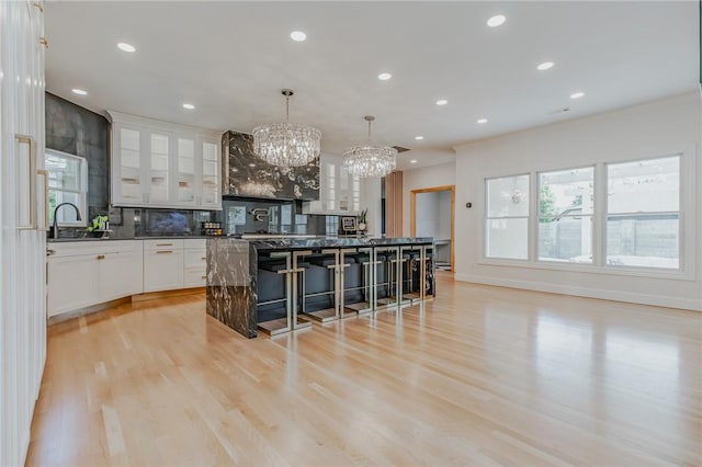 4 W Colonial Dr, Rogers, AR 72758 - kitchen featuring a chandelier, dark countertops, plenty of natural light, backsplash, and recessed lighting