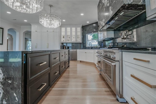 4 W Colonial Dr, Rogers, AR 72758 - kitchen featuring appliances with stainless steel finishes, dark countertops, a chandelier, white cabinets, and recessed lighting