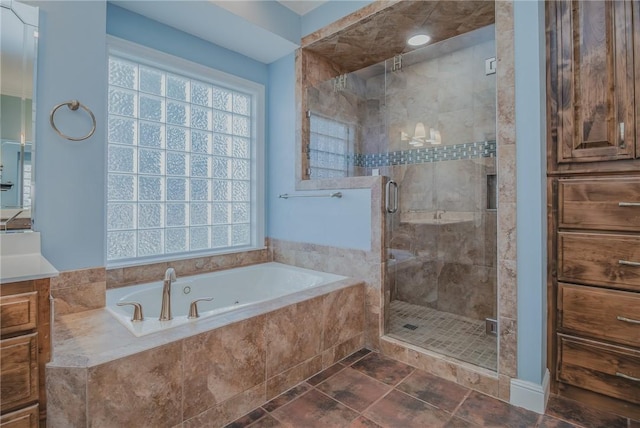 4 W Colonial Dr, Rogers, AR 72758 - full bathroom with vanity, a tub with jets, and a stall shower