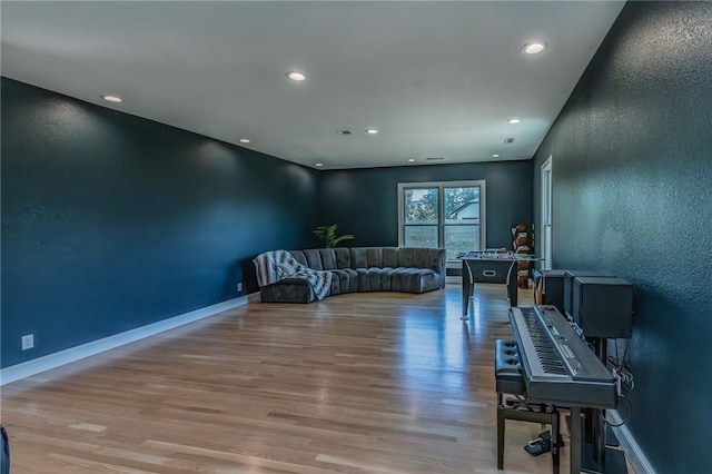 4 W Colonial Dr, Rogers, AR 72758 - living area with light wood-type flooring, recessed lighting, and baseboards