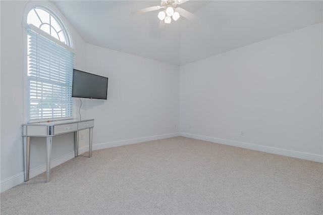 4 W Colonial Dr, Rogers, AR 72758 - unfurnished living room with ceiling fan, carpet floors, vaulted ceiling, plenty of natural light, and baseboards