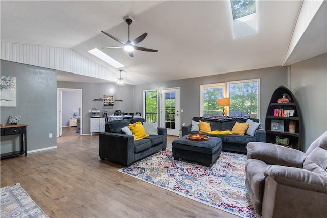 3 Summit Dr, Holiday Island, AR 72631 - living area featuring a skylight, lofted ceiling, a ceiling fan, wood finished floors, and baseboards