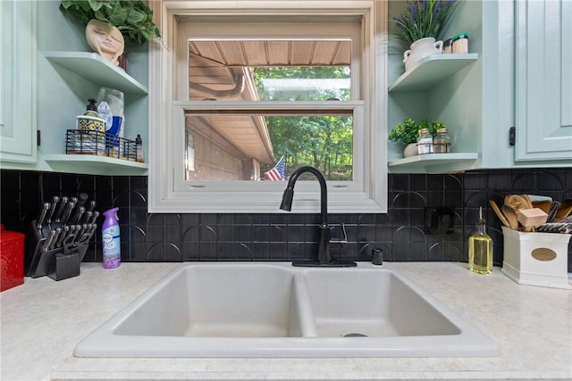 3 Summit Dr, Holiday Island, AR 72631 - kitchen with open shelves, a sink, backsplash, and light countertops