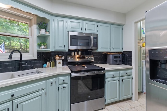 3 Summit Dr, Holiday Island, AR 72631 - kitchen featuring appliances with stainless steel finishes, a sink, light countertops, and light tile patterned floors