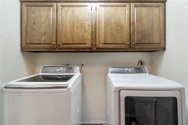 81 Overton Dr, Bella Vista, AR 72714 - laundry room featuring washing machine and dryer and cabinet space