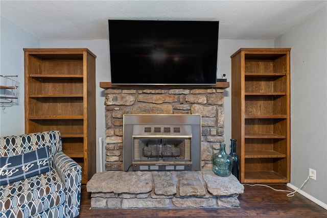 81 Overton Dr, Bella Vista, AR 72714 - living area with a stone fireplace, wood finished floors, and baseboards