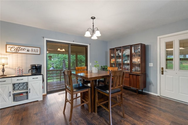 81 Overton Dr, Bella Vista, AR 72714 - dining room with a chandelier and dark wood-style flooring