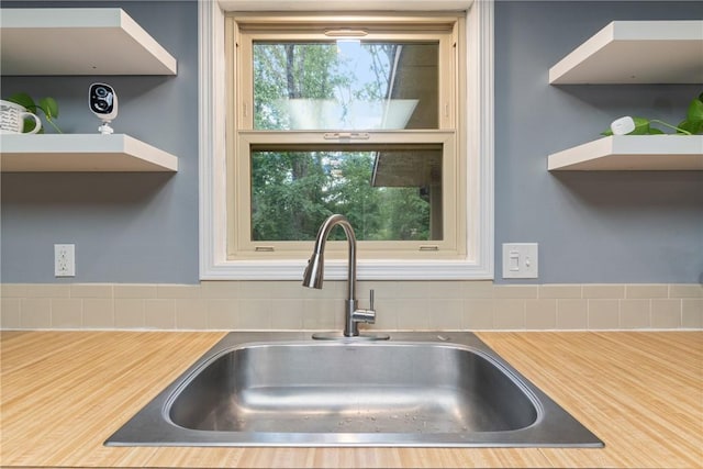 81 Overton Dr, Bella Vista, AR 72714 - kitchen view of a sink, open shelves, and light countertops