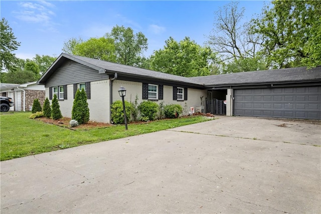 309 Sanders Ave, Springdale, AR 72764 - ranch-style home with a garage, concrete driveway, a front lawn, and brick siding