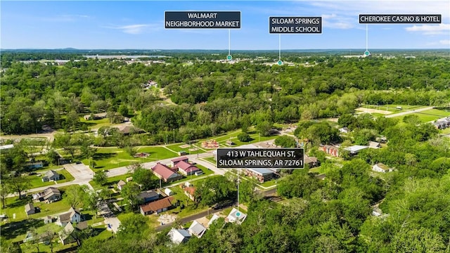 413 W Tahlequah St, Siloam Springs, AR 72761 - view of property location featuring a heavily wooded area