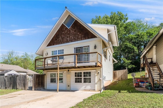 413 W Tahlequah St, Siloam Springs, AR 72761 - view of front of home featuring stairway, driveway, a patio area, and a deck