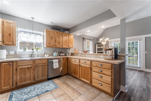 413 W Tahlequah St, Siloam Springs, AR 72761 - kitchen featuring stainless steel dishwasher, a peninsula, light countertops, pendant lighting, and a sink