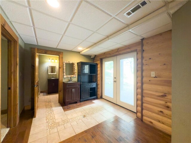 463 County Road 2281, Eureka Springs, AR 72631 - kitchen featuring french doors, light wood finished floors, a drop ceiling, and a sink