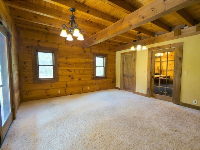 463 County Road 2281, Eureka Springs, AR 72631 - carpeted empty room featuring a chandelier, wooden ceiling with exposed beams, wood walls, and baseboards