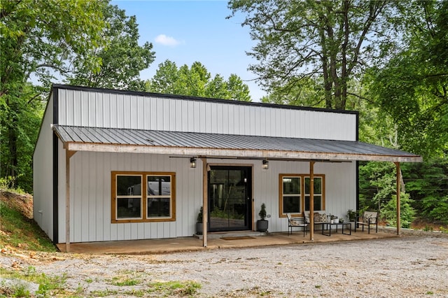 18097 Clear Water Rd, Fayetteville, AR 72704 - back of house featuring covered porch and metal roof