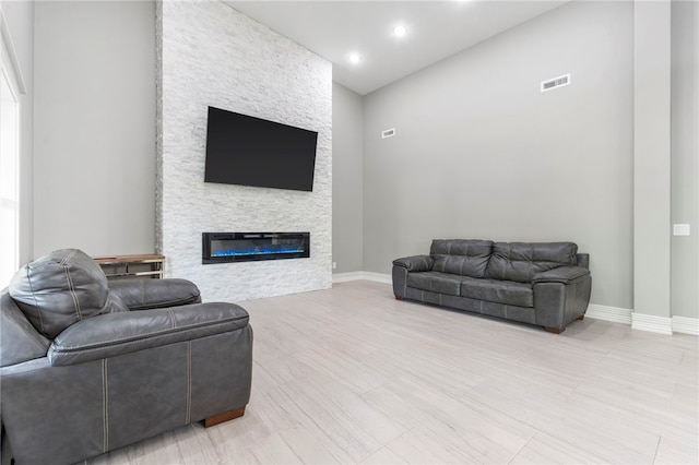 18097 Clear Water Rd, Fayetteville, AR 72704 - living room with a fireplace, baseboards, and recessed lighting