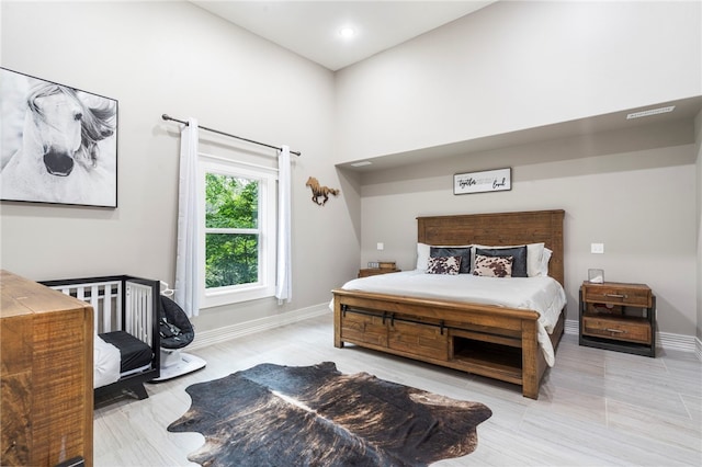 18097 Clear Water Rd, Fayetteville, AR 72704 - bedroom with a towering ceiling and baseboards