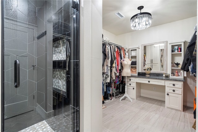 18097 Clear Water Rd, Fayetteville, AR 72704 - walk in closet featuring a chandelier