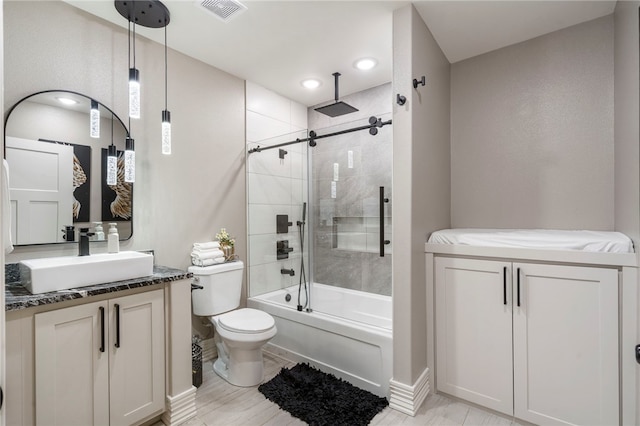 18097 Clear Water Rd, Fayetteville, AR 72704 - full bathroom featuring vanity, toilet, a combined bath / shower with rainfall shower, recessed lighting, and baseboards