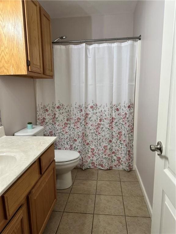 20944 Shady Grove Rd, Siloam Springs, AR 72761 - bathroom with vanity, tile patterned flooring, toilet, curtained shower, and baseboards