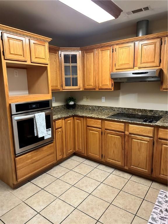 20944 Shady Grove Rd, Siloam Springs, AR 72761 - kitchen with stainless steel oven, under cabinet range hood, black electric cooktop, and light tile patterned floors
