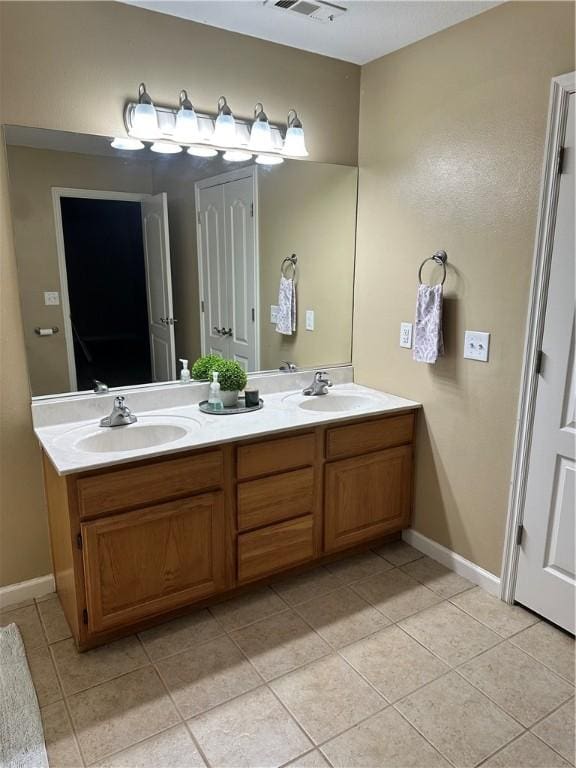 20944 Shady Grove Rd, Siloam Springs, AR 72761 - full bathroom with tile patterned flooring, double vanity, and baseboards