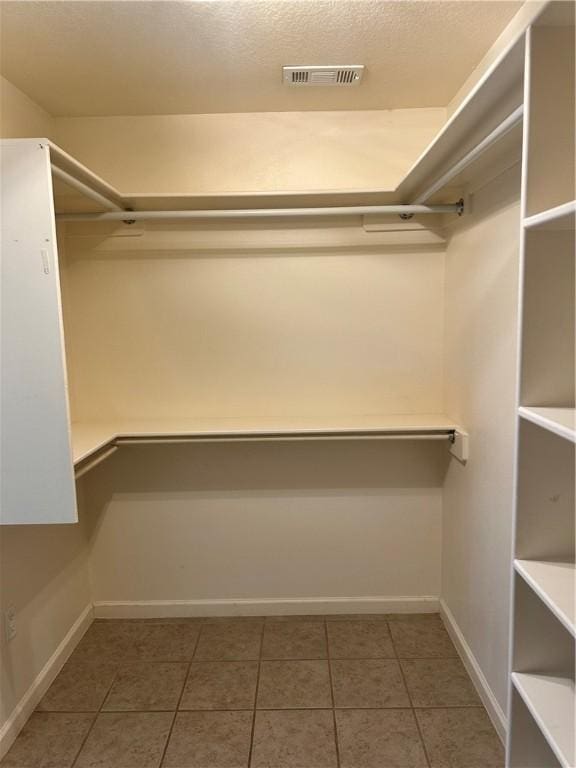 20944 Shady Grove Rd, Siloam Springs, AR 72761 - spacious closet featuring tile patterned flooring