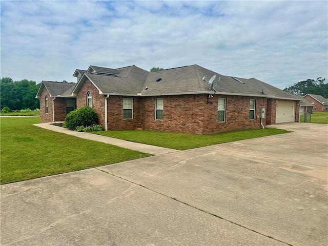 20944 Shady Grove Rd, Siloam Springs, AR 72761 - view of side of home with concrete driveway, brick siding, a yard, an attached garage, and a shingled roof