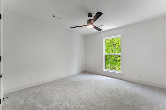 41 Westmorland Dr, Bella Vista, AR 72714 - unfurnished room with carpet floors, a ceiling fan, and baseboards