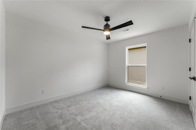 41 Westmorland Dr, Bella Vista, AR 72714 - spare room featuring carpet flooring, ceiling fan, and baseboards