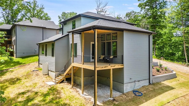 41 Westmorland Dr, Bella Vista, AR 72714 - rear view of house featuring stairs, a wooden deck, and roof with shingles