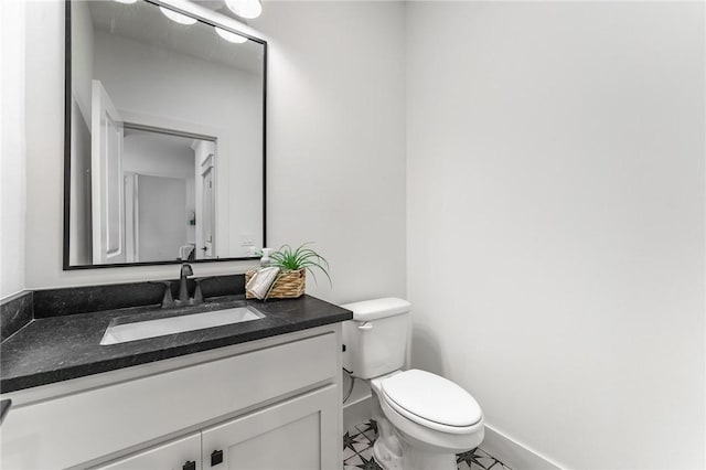 41 Westmorland Dr, Bella Vista, AR 72714 - half bath with vanity, toilet, baseboards, and tile patterned flooring