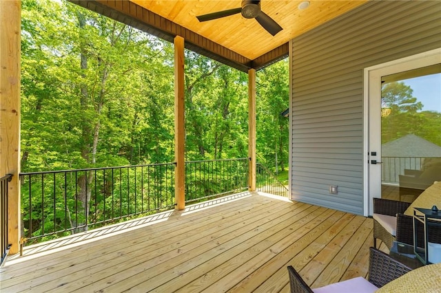 41 Westmorland Dr, Bella Vista, AR 72714 - deck with a ceiling fan and a wooded view