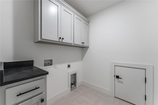 41 Westmorland Dr, Bella Vista, AR 72714 - washroom with cabinet space, hookup for an electric dryer, baseboards, hookup for a washing machine, and light floors