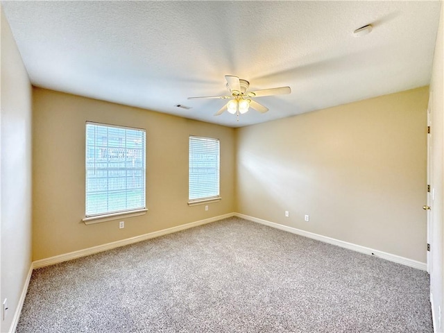 4671 Bailey Cir, Springdale, AR 72762 - unfurnished room with carpet floors, a ceiling fan, baseboards, and a textured ceiling