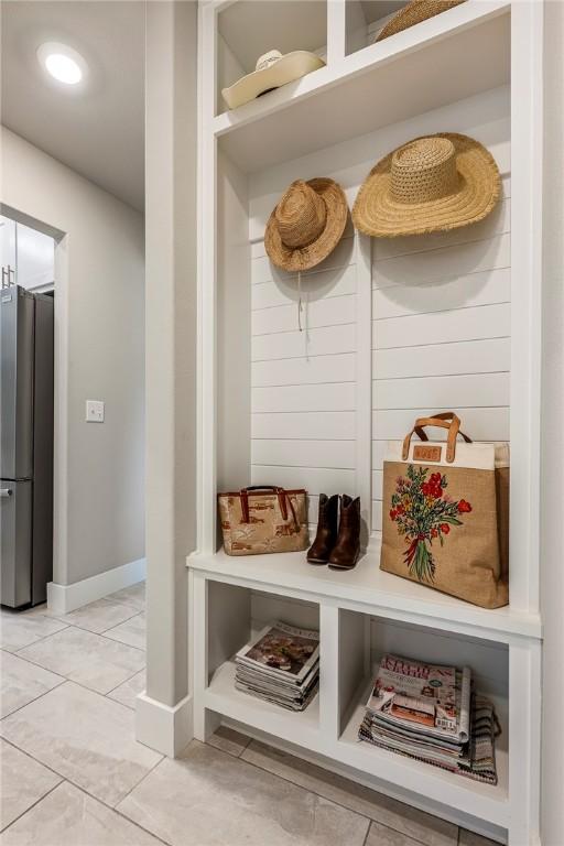 13 Ingleborough Dr, Bella Vista, AR 72715 - mudroom with light tile patterned floors and baseboards