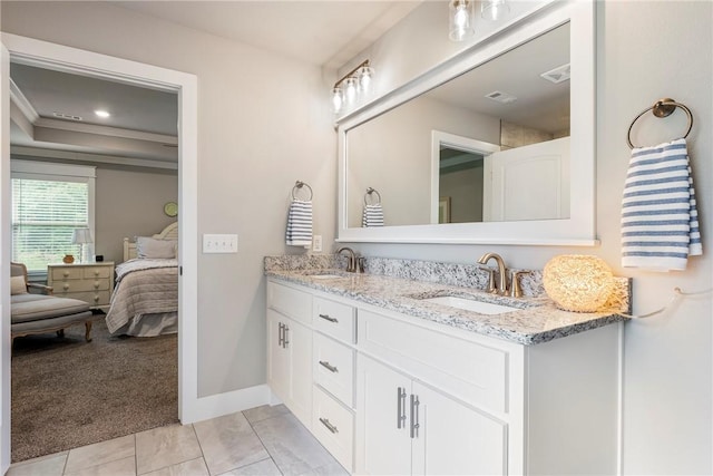 13 Ingleborough Dr, Bella Vista, AR 72715 - ensuite bathroom featuring double vanity, baseboards, tile patterned flooring, and recessed lighting