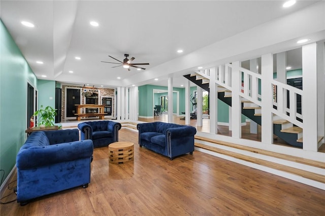 605 SW O St, Bentonville, AR 72712 - living area featuring wood finished floors, recessed lighting, stairway, ceiling fan, and baseboards