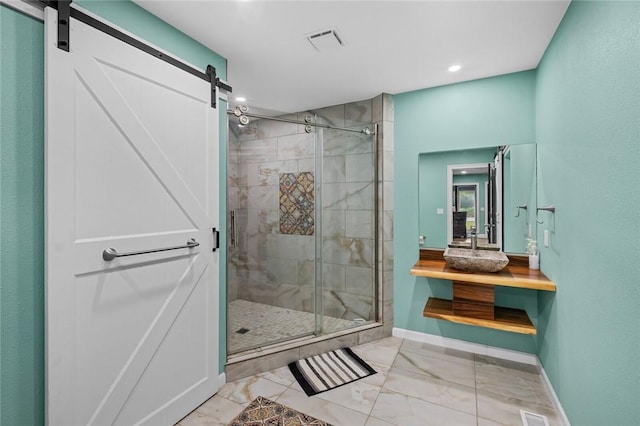 605 SW O St, Bentonville, AR 72712 - bathroom with marble look tile flooring, a shower stall, baseboards, vanity, and recessed lighting