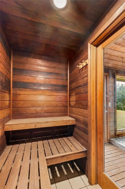 605 SW O St, Bentonville, AR 72712 - sauna with wood walls, wood ceiling, and tile patterned floors