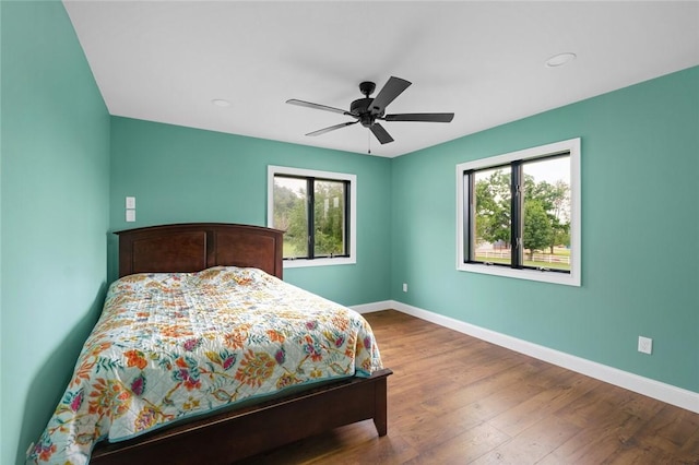 605 SW O St, Bentonville, AR 72712 - bedroom with multiple windows, baseboards, wood finished floors, and recessed lighting