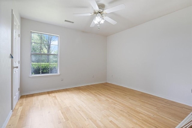 17171 Kincheloe Rd, Siloam Springs, AR 72761 - spare room with light wood-type flooring, baseboards, and ceiling fan