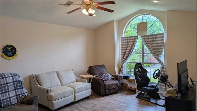 2560 Jayme Cir, Conway, AR 72032 - living area with ceiling fan, wood finished floors, and lofted ceiling