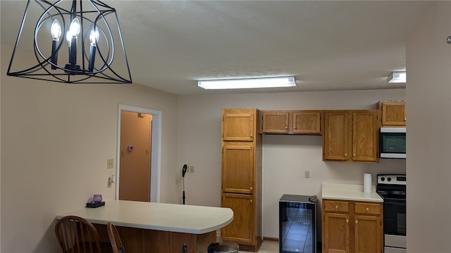 2560 Jayme Cir, Conway, AR 72032 - kitchen with electric range, beverage cooler, brown cabinetry, light countertops, and a chandelier