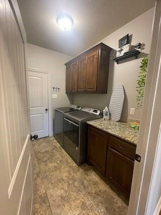 10211 Lydia Ln, Danville, AR 72833 - laundry area featuring cabinet space and separate washer and dryer