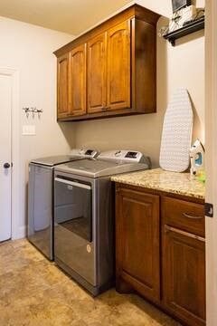 10211 Lydia Ln, Danville, AR 72833 - laundry area with cabinet space and separate washer and dryer