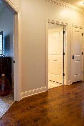 10211 Lydia Ln, Danville, AR 72833 - hallway with wood finished floors, ornamental molding, and baseboards