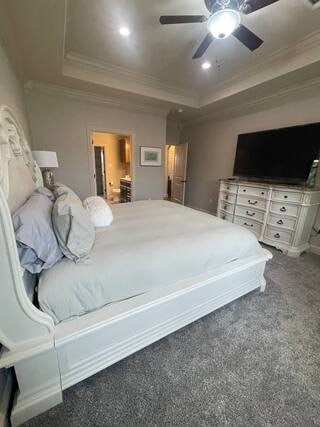 10211 Lydia Ln, Danville, AR 72833 - carpeted bedroom featuring a tray ceiling, ornamental molding, and a ceiling fan